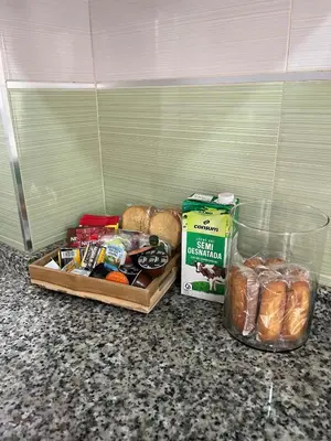 a counter with bread and other food items on it at Estupendo apartamento en Llíria in Lliria