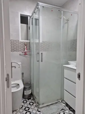 a bathroom with a glass shower and a toilet at Valencia Centro 3 compartido in Valencia