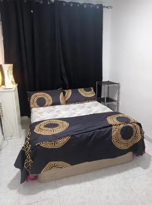 a bedroom with a bed with a black curtain at Valencia Centro 3 compartido in Valencia