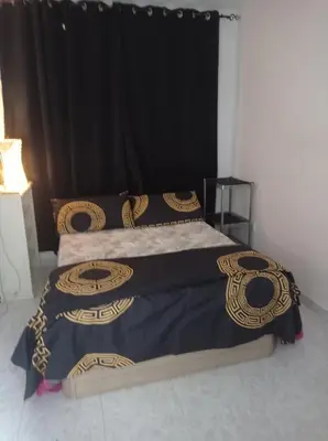 two beds in a room with a black curtain at Valencia Centro 3 compartido in Valencia