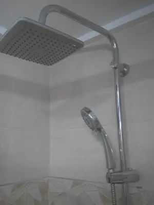 a shower with a shower head in a bathroom at Ca Erik in Mareny Barraquetas