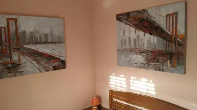 two pieces of art hanging on a wall at Ca Erik in Mareny Barraquetas