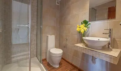 a bathroom with a toilet and a sink at Beautiful House with terrace in Valencia