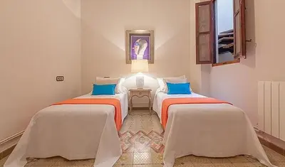 a room with two beds in a room at Beautiful House with terrace in Valencia
