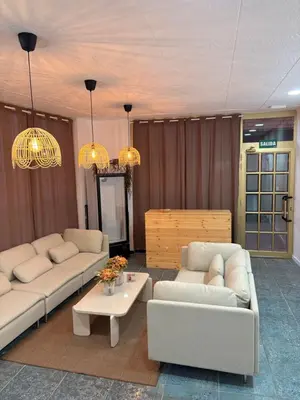 a living room with two couches and a coffee table at LITTLE Hostel in Puerto de Sagunto