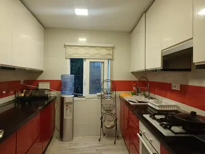 a kitchen with a sink and a stove top oven at Beautiful bedroom Country Villa with swimming pool in Lliria
