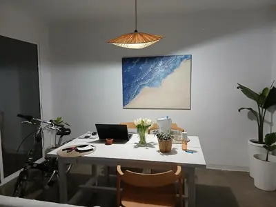 an office with a desk with a laptop and plants at El Faro de Nules in Mascarell