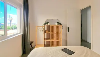 a bedroom with a bed and a window at Faro de Nules in Mascarell
