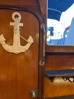 a door with an anchor on the side of a boat at Unique Experience in Sailboat! In The 4 Seasons!! B shi in Valencia
