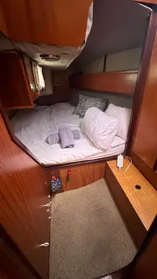 a small bed in the middle of a small room at Unique Experience in Sailboat! In The 4 Seasons!! B shi in Valencia