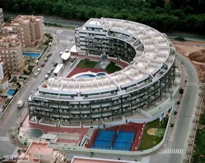 a large building with a road in front of it at Apartamento Timia OASIS in Canet de Berenguer