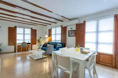 a living room with a white table and chairs at Apartment 1 bedroom Mercado Central in Valencia