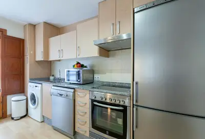 a kitchen with a refrigerator and a microwave at Apartment 1 bedroom Mercado Central in Valencia