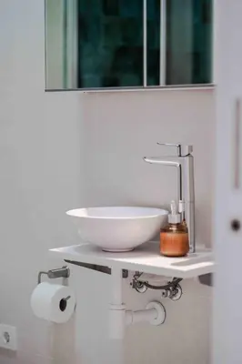 a bathroom with a white sink and a mirror at Boutique Loft 1 next to Torres de Serrano in Valencia