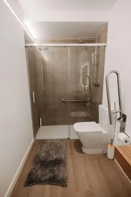 a bathroom with a shower with a toilet and a sink at Luxury apartment in Valencia in Valencia