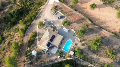 an overhead view of a house with a swimming pool at Chalet en la naturaleza in Macastre