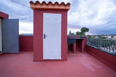 a white door on the roof of a building at Villa Naranjos - Sauna - Jacuzzi - Gym - BBQ in Picassent