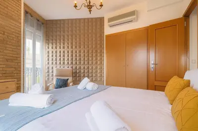 a bedroom with a large bed with white towels at Apartment in the center of Valencia in Valencia