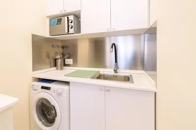a kitchen with a sink and a washing machine at Apartment in the center of Valencia in Valencia