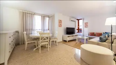 a living room with a table and a couch at Historic Center - Loft in the heart of Valencia in Valencia