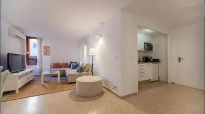 a white living room with a couch and a table at Historic Center - Loft in the heart of Valencia in Valencia