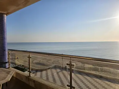 a balcony with a view of the ocean at Casa Xalera in Mareny Barraquetas