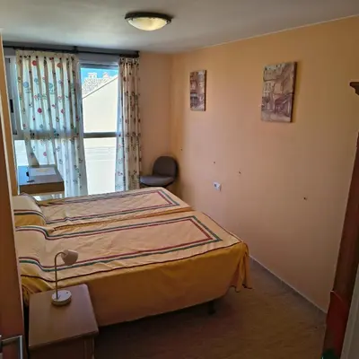 a bedroom with a bed in a room with a window at Casa Xalera in Mareny Barraquetas