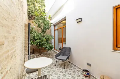 a small balcony with a table and a chair at Guestready - Bright stay at Cabanyal in Valencia
