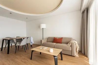 a living room with a couch and a table at B48 Valencia Feria in Valencia