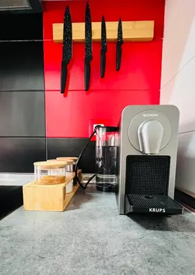 a kitchen counter with a coffee maker and a microwave at Ubicación ideal, entre la playa y el centro ciudad in Valencia