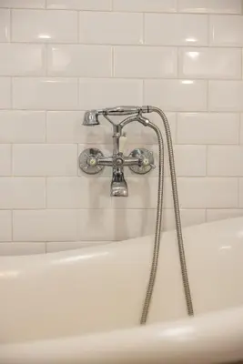 a white bathroom with a tub and a sink at Bubu 11 in Valencia