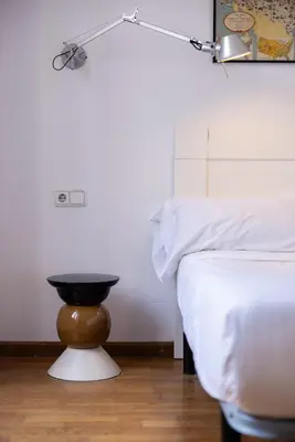 a white tub in a bathroom with a tile floor at Bubu 11 in Valencia