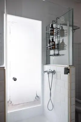 a door to a bathroom with a tub and a sink at Bubu 11 in Valencia