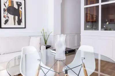 a bedroom with a bed and a desk and a window at Bubu 11 in Valencia