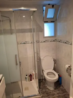 a bathroom with a toilet and a shower at Sea and Sun con vistas a la playa San Antoni in Cullera