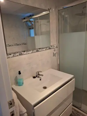 a white bathroom with a sink and a shower at Sea and Sun con vistas a la playa San Antoni in Cullera