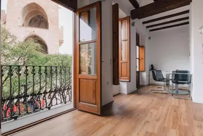an open hallway with a door and a balcony at Trenor Apartments in Valencia