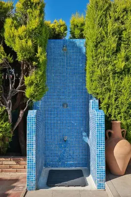 a blue tile wall with trees and a vase at Your Paradise with Pool - 2 min from Beach in Moncófar