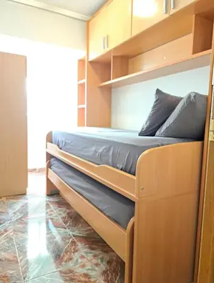 a bedroom with two bunk beds in a room at Habitación con dos camas para dos personas in Valencia
