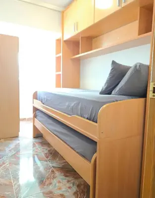 a bedroom with two bunk beds in a room at Habitación con dos camas para dos personas in Valencia