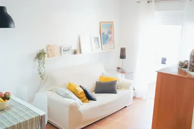 a white couch with pillows on it in a living room at Blanca Mar in Barrio-Mar