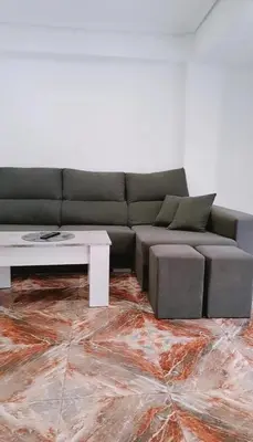 a living room with a couch and a coffee table at Habitación cómoda in Valencia
