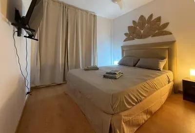 a bedroom with a bed in a room with a window at Apartmento en 5 Mares in Puebla de Farnals