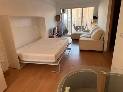 a hospital room with a bed and a couch at Apartmento en 5 Mares in Puebla de Farnals