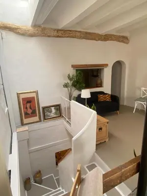 a view of a living room with a staircase at Casa Albacora 1892 in Losa del Obispo