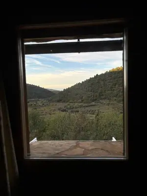 a window with a view of a mountain view at La Ontina Alojamientos Rurales in Abejuela