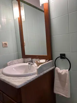 a bathroom with a sink and a mirror at La Ontina Alojamientos Rurales in Abejuela