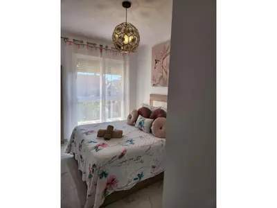 a bedroom with a bed with teddy bears on it at Apartment in Vera with rooftop pool in Valencia
