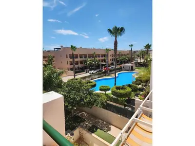 a view of the pool from the balcony of a resort at Apartment in Vera with rooftop pool in Valencia