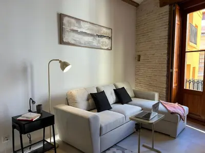 a living room with a couch and a table at Apartamentos Valencia Centro 1 in Valencia